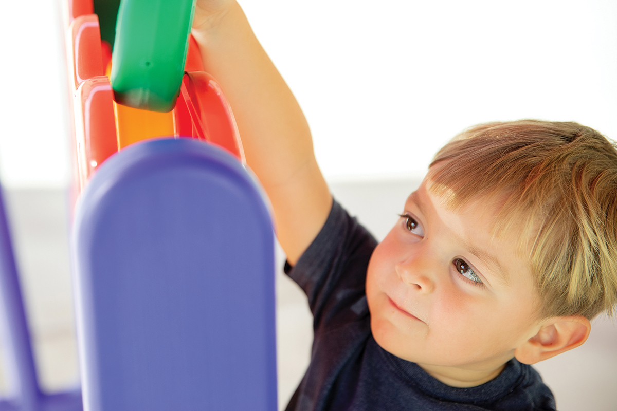 Little boy playing with blocks