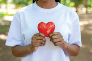 Woman holding heart