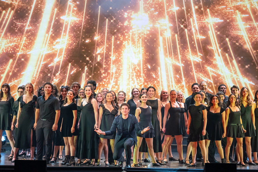 Majestic Empire Cast on Stage in spotlights