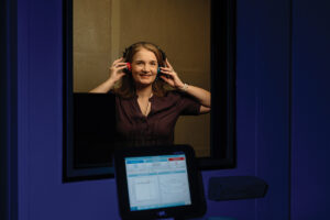 Person in Audicles Hearing booth