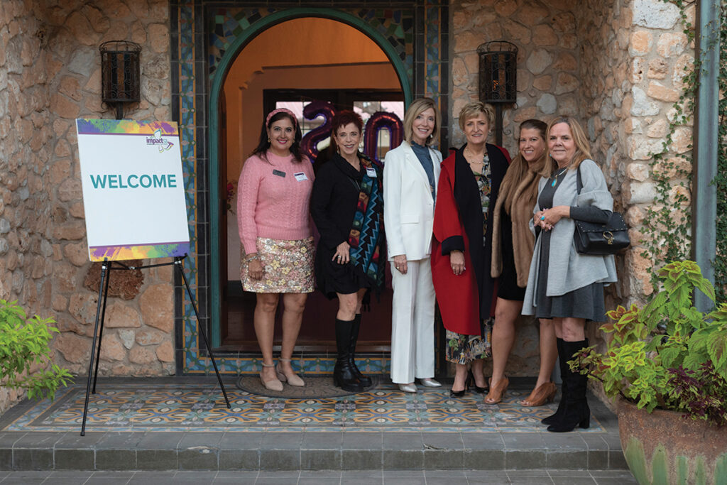 Impact team at door of event