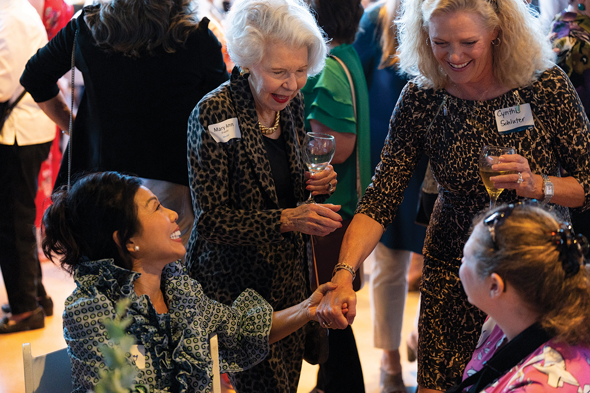 Four ladies greeting each other